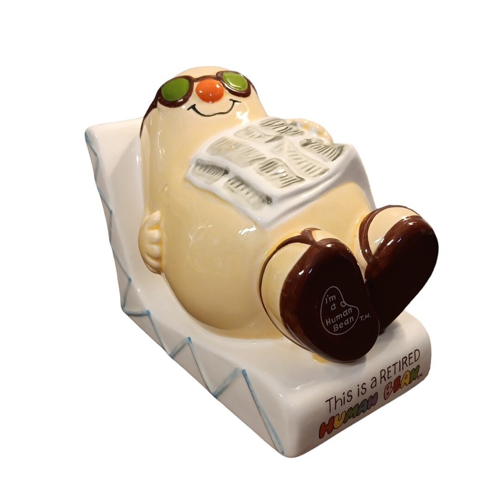 This is a Retired Human Man Bean Lounging on Chaise Chair Gift Bank Enesco READ